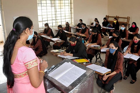 Students and a teacher in a classroom