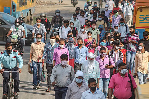 People wearing mask and walking