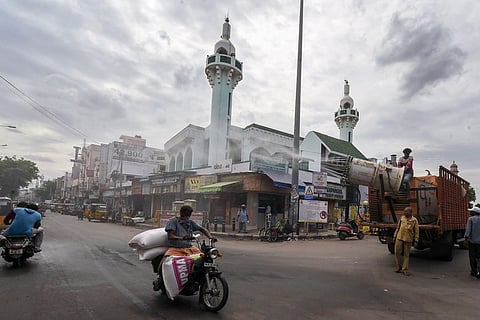 Chennai Municipal Corporation workers spray disinfectant on a street, during the ongoing COVID-19 pandemic