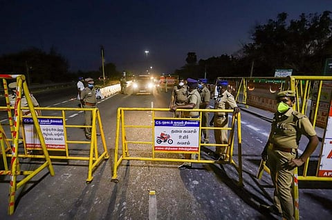 Police patrolling a lane during night curfew in Pudducherry