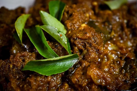 Curry leaves on meat curry