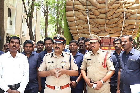 Police briefing the media at the backdrop of the seized ganja