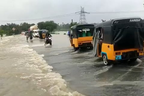 Rain water hindering the movement of vehicles on the national highway in Vizianagaram
