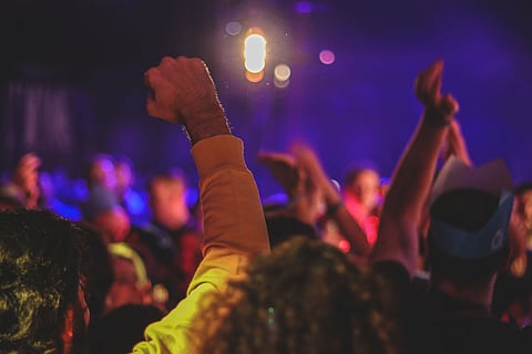 Representative image of people in a DJ party