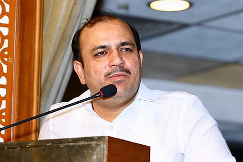 BSP MP Danish Ali wearing white shirt and speaking into a mic