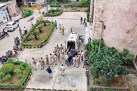 Injured during firing at Rohini court being taken inside an ambulance