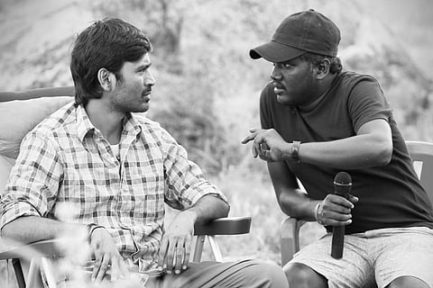 Director Mari Selvaraj is seen talking to actor Dhanush.