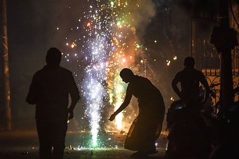 People lighting firecrackers