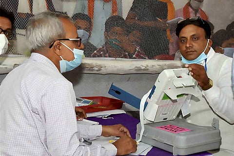 Two people counting votes