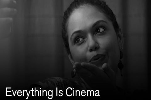 The protagonist is seen in the poster o the movie 'Everything is Cinema'.