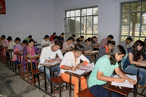 Aspirants writing a B Ed entrance examination in Uttar Pradesh