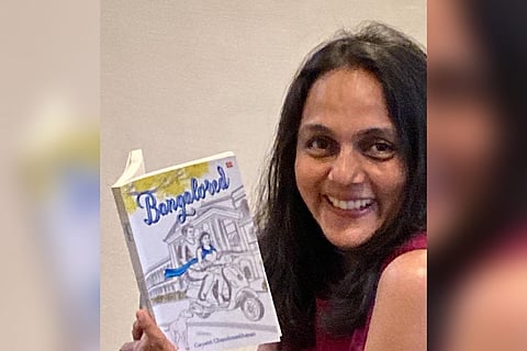 Gayatri Chandrasekhran posing with her book Bangalored