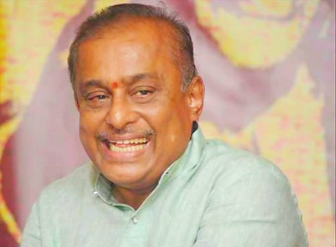 Kannada composer Hamsalekha smiling looking left