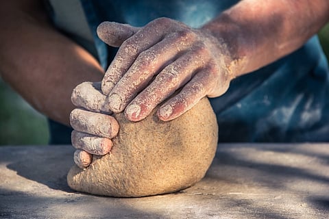 baker making bread