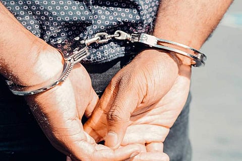 Person in handcuffs