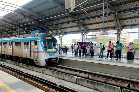 Commuters at a Hyderabad Metro station