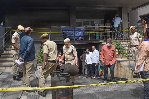 Hyderabad police outside the electric bike showroom where a fire mishap killed eight people