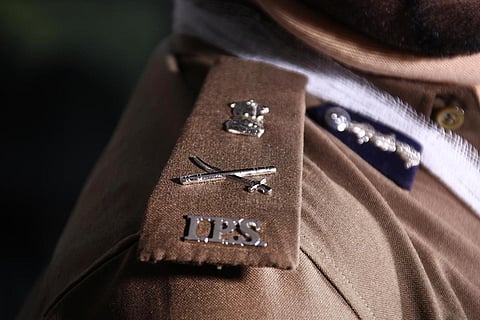 IPS badge on a policer officer wearing the uniform