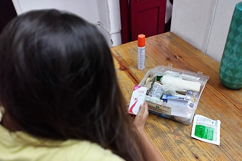 Image for representation. Woman looks at iPill.