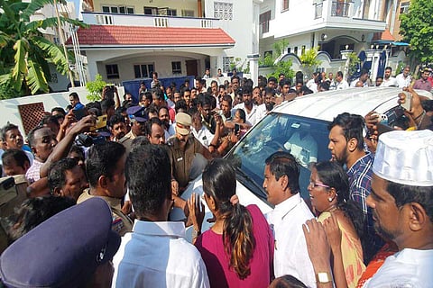 Supporters of minister Senthil Balaji surrounding the cars of IT officials in Karur
