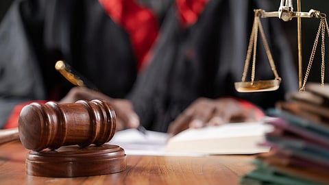 A gavel and a balance on a judge's table