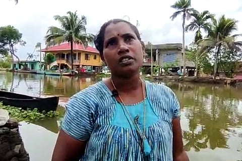 Jyothi a native of Kuttanad who lost her house in flood against the backdrop of backwaters.