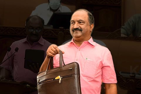 Kerala Finance Minister KN Balagopal holding a briefcase bag with budget document