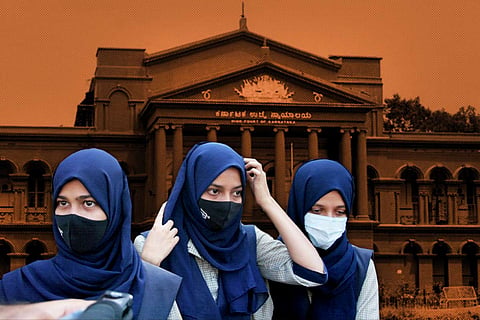 Three hijab-clad students in the foreground with the Karnataka High Court in the background