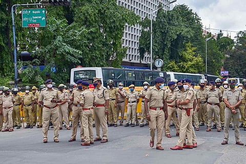 A group of policemen standing at a square in Bengaluru