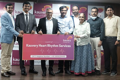Kauvery hospital staff with woman who was treated for cardiac arrhythmias