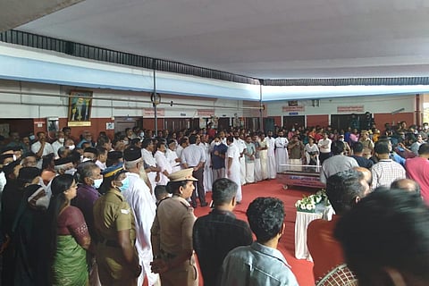 People waiting to pay homage to students and teacher who died in bus mishap