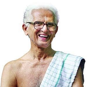 Kerala Poet Vishnunarayan Namboothiri with a towel on his bare chest smiling