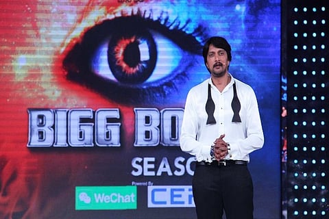 Kichcha Sudeep is seen hosting Bigg Boss Kannada.