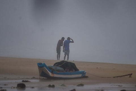 Two men endure the storm as Cyclone Nivar reached Chennai