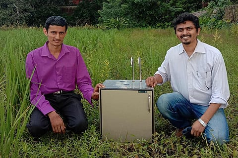Dr Vishnu Prasada Bhat and Sandeep Kondaji with soil testing device