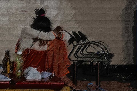 Colour sketch of a woman sitting on a chair with her head over her knees