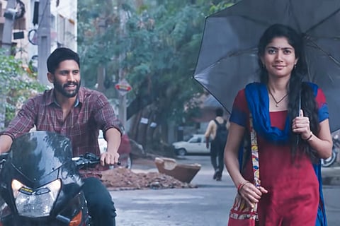 Naga Chaitanya following Sai Pallavi on a bike
