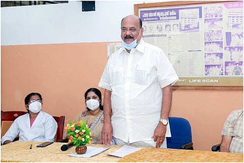 Kerala NCP Leader Mani C Kappan wearing blue mask speaking in a meeting