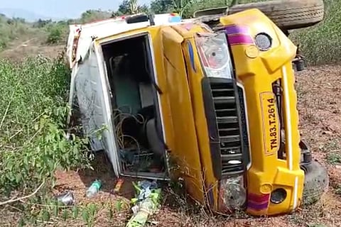Mini-van topples