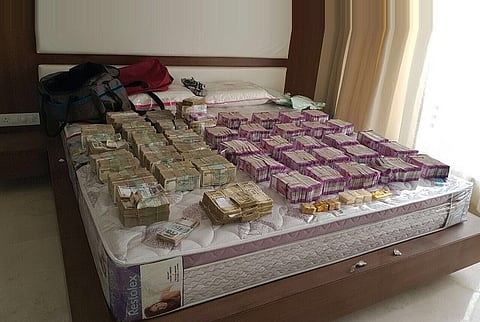 While you were waiting in queues these bureaucrats were caught with Rs 4.7 crores in new notes