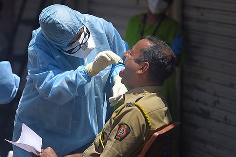 Medical staff collecting samples of a cop