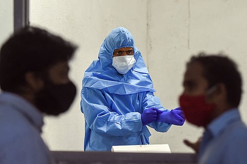 Health professional in PPE kit