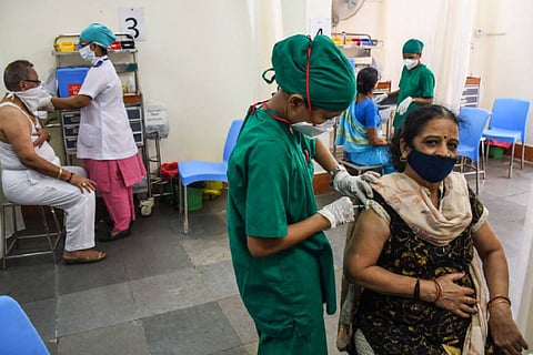 People getting vaccinated at a health centre in Mumbai