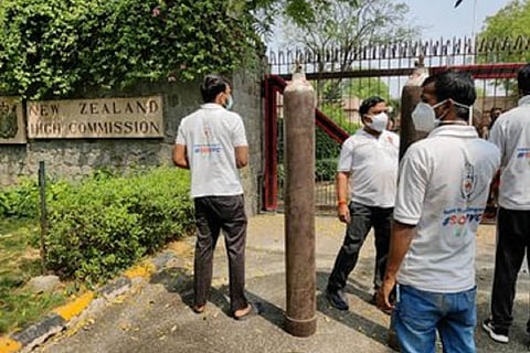 Indian Youth Congress volunteers at the NZ High Commission with oxygen cylinder