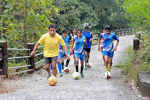 Coach Jomon along with football trainees