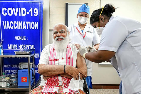 Prime Minister Narendra Modi getting vaccinated