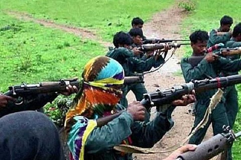 Maoists training with their weapons