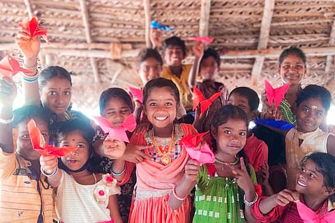 Children smiling and posing at an art workshop in Thanjavur conducted by NGO POPE
