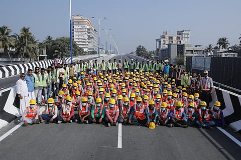 Workers , who constructed Palarivattom flyover of Kerala's Kochi, posing for a group photo sitting on the flyover when it was reopened