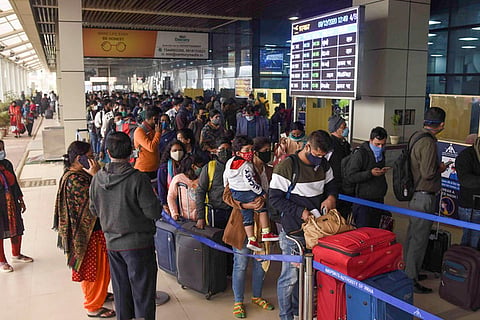 Passengers stand in queues at Jaiprakash Narayan Airport in Patna in Dec 2020
